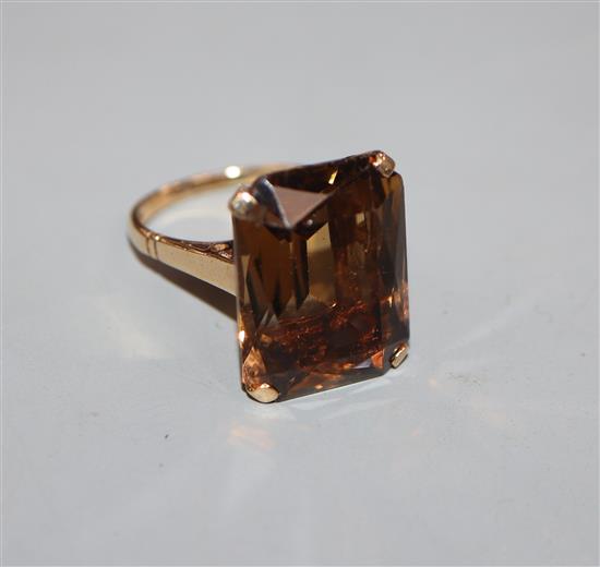 A 1960s 9ct gold and emerald cut citrine set dress ring, size O.